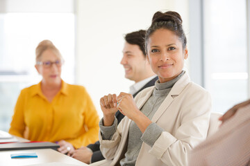 Obraz premium Portrait of smiling businesswoman in conference room meeting