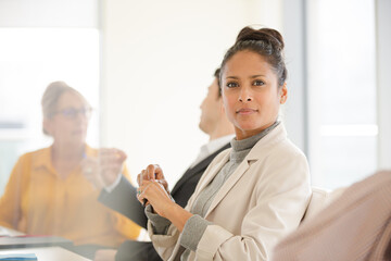 Fototapeta premium Portrait of smiling businesswoman in conference room meeting
