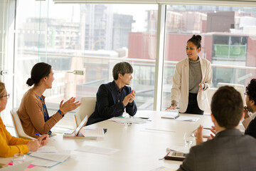 Businesswoman leading conference room meeting