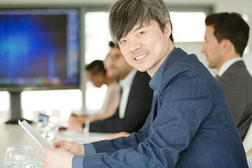 Portrait of businessman in conference room meeting