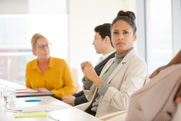Obraz premium Portrait of smiling businesswoman in conference room meeting