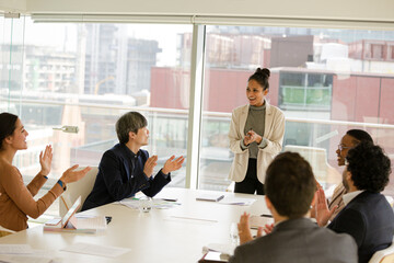 Businesswoman leading conference room meeting