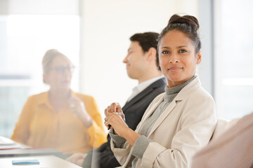 Portrait of smiling businesswoman in conference room meeting