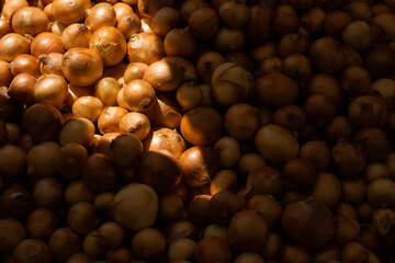Fresh onions on market. Sunbeam is shining on the onion in the Turkish market.