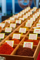 Assortment of Turkish spices and herbs in wooden bowls. Turkish market spices such as saffron, sumac and thyme. Cumin, rosemary and isot.