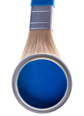 Opened can of blue paint with brush on white background top view