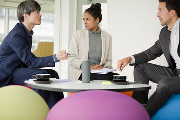 Business people brainstorming in relax zone