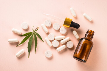 CBD pills and CBD oil in glass bottle. Herbal medicine. Sedative, antibiotic, antioxidant using....
