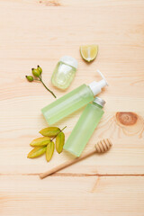 Natural cosmetic products on a light wooden. Mockup of cosmetic bottles.