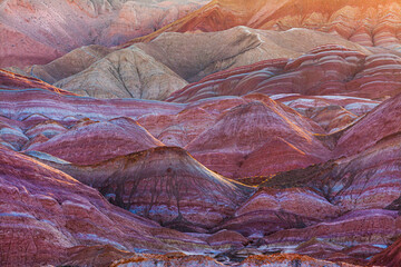 Sunrise over the colorful eroded badlands in the Zhangye Danxia National Geopark, Gansu Province, China