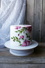 white cake with painted flowers