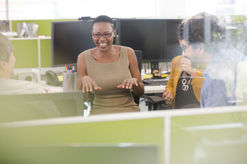 Business people brainstorming in open plan office