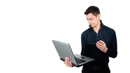 Funny handsome man with laptop. White background.