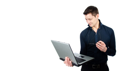 Funny handsome man with laptop. White background.