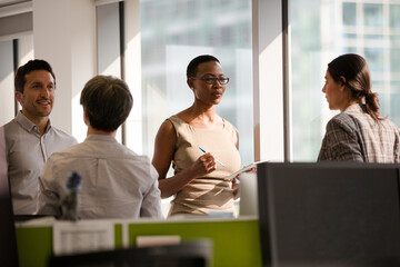 Fototapeta premium Business people talking in open plan office