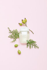 Natural cosmetic products on a pink background. Cosmetic bottle mockup.