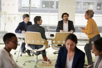 Enthusiastic business people working together in relax zone