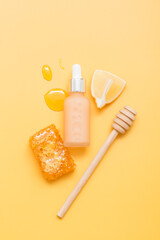 Natural cosmetic products on a yellow background. Cosmetic bottle mockup.