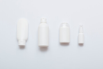 Natural cosmetic products on a white background. Mockup of cosmetic bottles.