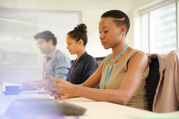 Portrait of smiling businesswoman sitting at conference room table