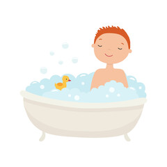 Funny boy washes in the bathroom with a yellow rubber duck.