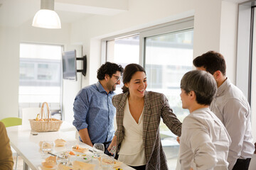 Business people enjoying sushi lunch in conference room