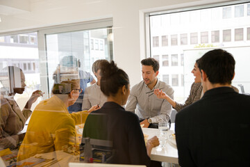 Business people enjoying sushi lunch