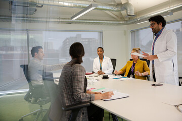 Businessman leading conference room meeting