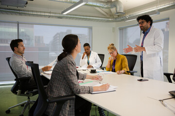 Businessman leading conference room meeting