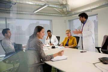 Businessman leading conference room meeting