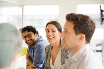 Business people enjoying sushi lunch in conference room