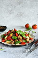The classic dish of baked vegetables is ratataui..Baked vegetable salad with sow and basil.