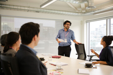 Businessman leading conference room meeting