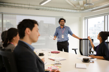 Businessman leading conference room meeting