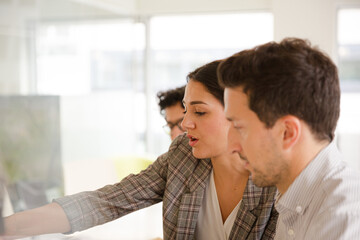 Business people enjoying sushi lunch in conference room