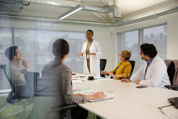 Businesswoman leading conference room meeting