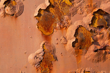 Peeling paint on the rust wall