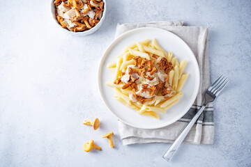 Chanterelle onion fried creamy pasta in a plate