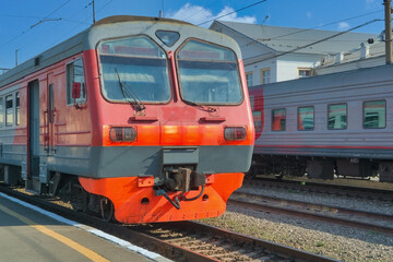 Fototapeta premium High-speed passenger electric train on the platform close-up.