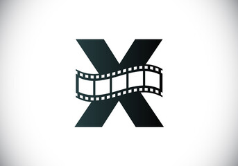 Fototapeta na wymiar Initial X monogram alphabet incorporated with film reel. Video and movie logo concept. Font emblem. Logo for the entertainment business and company identity