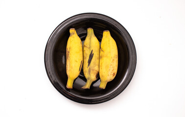banana on a plate isolated on a white background