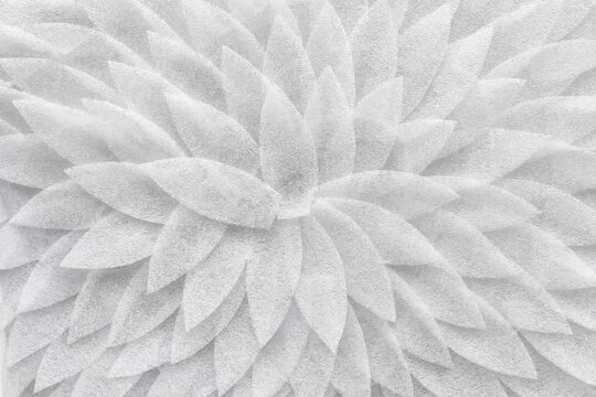 White pattern handmade of white petals rotating in swirl.