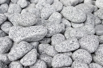 Background with rounded polished dotted stones.