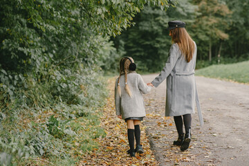 Fototapeta premium Cute and stylish family in a autumn park