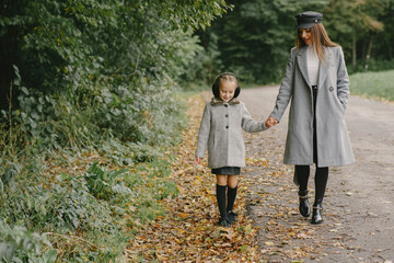 Fototapeta premium Cute and stylish family in a autumn park