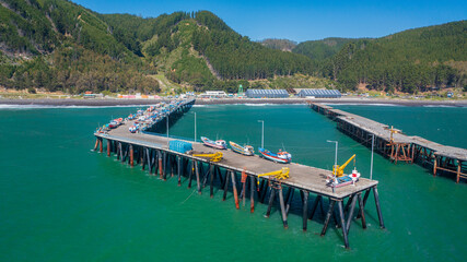 Puerto Maguillines, maule, constitucion chile. Aerial view with horizontal drone photo of port, beach and forest