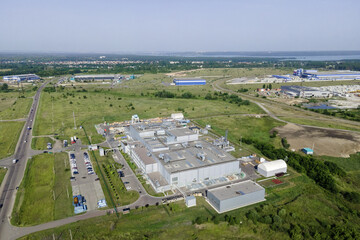 Industrial zone and technology park and logistics center with warehouse, loading hub. Industry from above, aerial shot