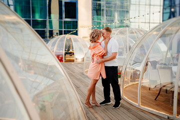 happy couple on rooftop. man and woman in love in original place for dating