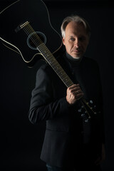 Attractive mature man with beard on plain background wearing casual 