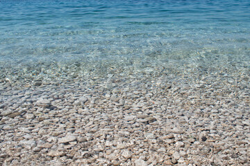 The sea is calm, space. Clear water, rocky shore in Croatia 